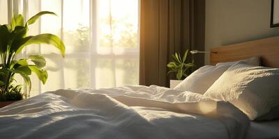 A bed with white sheets and pillows photo