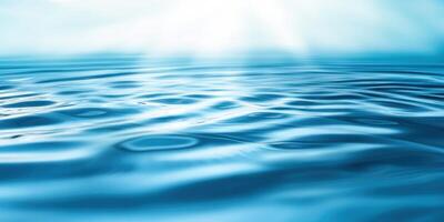 Water surface with sun rays and waves photo