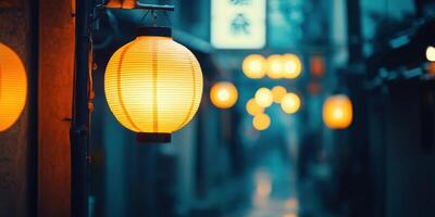 A street with a few lanterns hanging from the wall photo