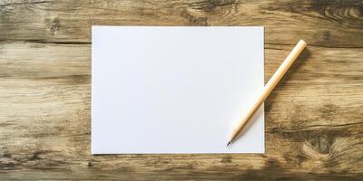 Blank paper and pencil on wooden table photo