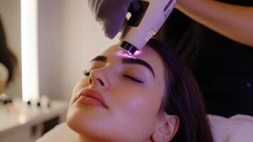A woman getting her hair done with a laser photo