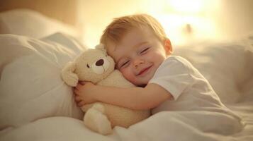 A young boy is hugging a teddy bear photo