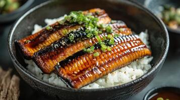 A bowl of rice with fish and vegetables photo
