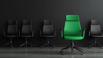 Green office chair in front of black wall photo