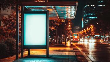 A bus stop with a blank billboard on the side of the road photo