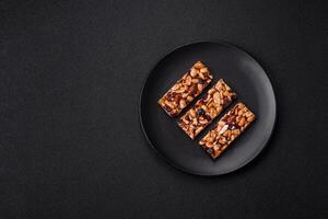 Delicious sweet nutrition bars with nuts, dried berries gluten free photo