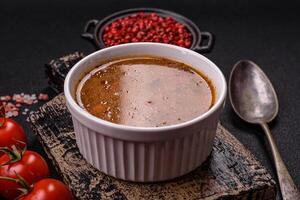 Delicious hot tomato soup with vegetables, vegan, vegetarian food photo