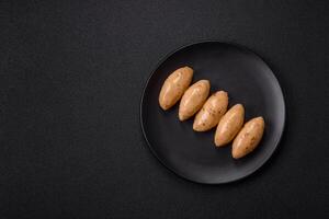 Fish or meat quenelles with delicate mushroom sauce, salt and spices photo