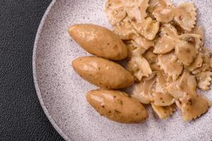 Fish or meat quenelles with delicate mushroom sauce, salt and spices photo