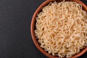 Rice noodles with mushrooms, vegetables, spices and herbs photo