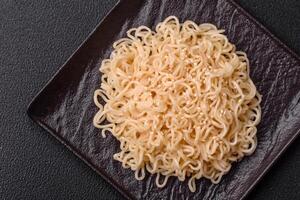 Rice noodles with mushrooms, vegetables, spices and herbs photo