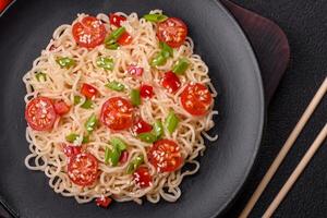 Rice noodles with mushrooms, vegetables, spices and herbs photo