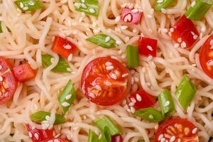 Rice noodles with mushrooms, vegetables, spices and herbs photo