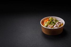 Delicious diet salad with turkey or chicken slices, lettuce, carrots, mozzarella photo