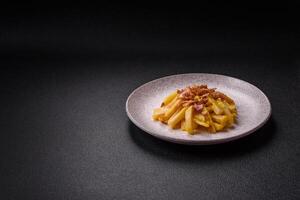 Crispy French fries with pieces of bacon, salt and spices photo