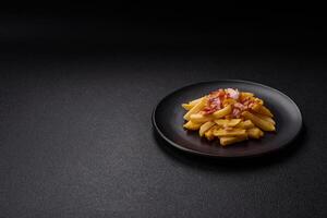 Crispy French fries with pieces of bacon, salt and spices photo