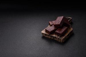 Rectangular chocolate candies with mousse and waffles photo