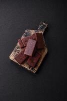 Rectangular chocolate candies with mousse and waffles photo