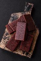Rectangular chocolate candies with mousse and waffles photo