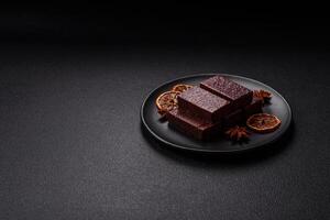 Rectangular chocolate candies with mousse and waffles photo