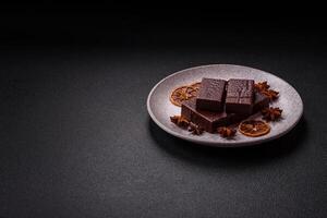 Rectangular chocolate candies with mousse and waffles photo