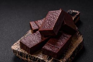 Rectangular chocolate candies with mousse and waffles photo