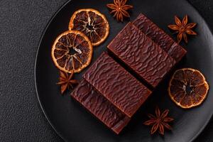Rectangular chocolate candies with mousse and waffles photo