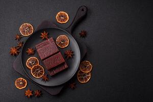 Rectangular chocolate candies with mousse and waffles photo