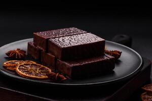 Rectangular chocolate candies with mousse and waffles photo
