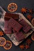 Rectangular chocolate candies with mousse and waffles photo