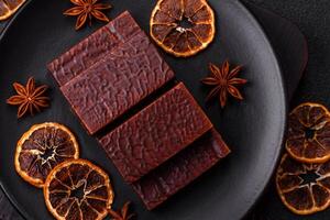 Rectangular chocolate candies with mousse and waffles photo