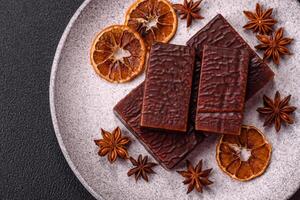 Rectangular chocolate candies with mousse and waffles photo