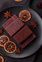 Rectangular chocolate candies with mousse and waffles photo