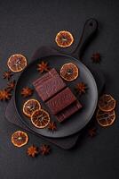 Rectangular chocolate candies with mousse and waffles photo