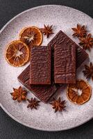 Rectangular chocolate candies with mousse and waffles photo