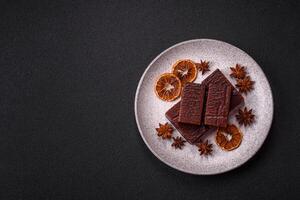 Rectangular chocolate candies with mousse and waffles photo