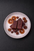 Rectangular chocolate candies with mousse and waffles photo
