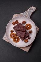 Rectangular chocolate candies with mousse and waffles photo