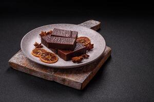 Rectangular chocolate candies with mousse and waffles photo