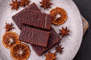 Rectangular chocolate candies with mousse and waffles photo