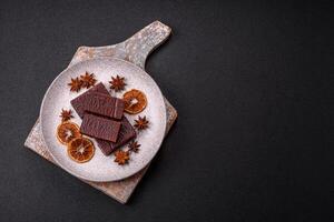Rectangular chocolate candies with mousse and waffles photo
