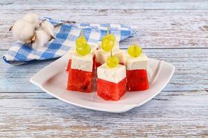 Watermelon with feta and grape photo