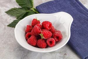 Ripe sweet and juicy organic raspberry photo