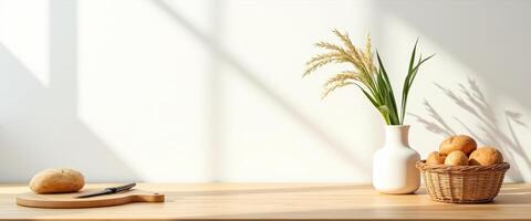 Wooden Tabletop with Bread, Knife, Vase and Basket of Bread Rolls photo