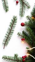 Christmas Ornaments and Pine Branches on White Background photo