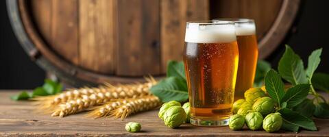 Two Glasses of Beer with Wheat and Hops on Wooden Table photo