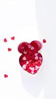 Heart-Shaped Box Filled with Red and Pink Hearts photo