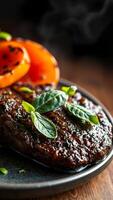 Close-up of Grilled Steak with Basil and Grilled Peppers on a Plate photo