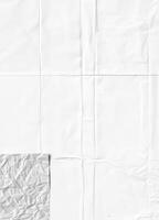 White crumpled paper texture with visible folds, ideal for backgrounds or design elements. photo