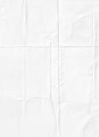 White crumpled paper texture with visible folds, ideal for backgrounds or design elements. photo